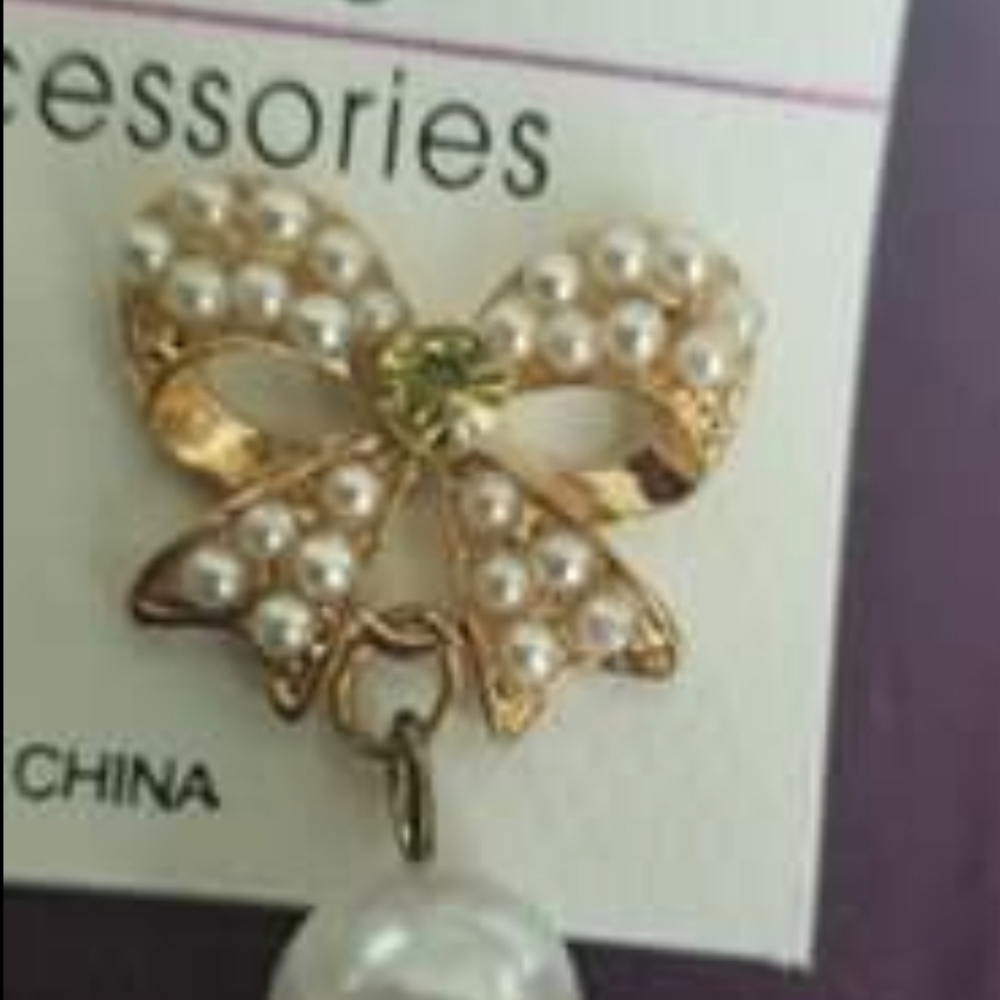 Gold tone bow pearl and rhinestone earrings
